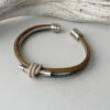 Lederarmband mit Knoten in taupe und petrol