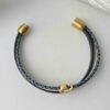 Armband mit Fisch Gold in blau-beige